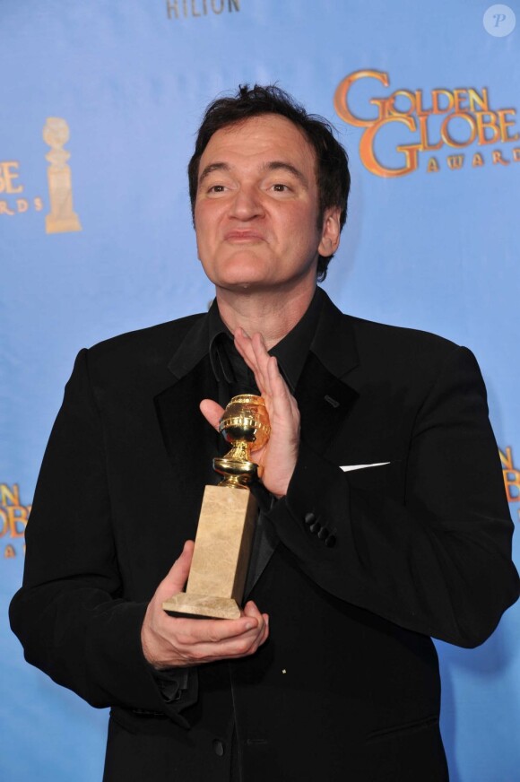 Quentin Tarantino avec sa récompense lors des Golden Globe Awards, le 13 janvier 2013.