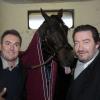 Le cheval Ready Cash qui tire la langue avec Lucien Jean-Baptiste, Fabien Onteniente, et Philippe Duquesne du film Turf, lors du 92eme Grand Prix d'Amérique à l'hippodrome de Vincennes, le 27 janvier 2013.