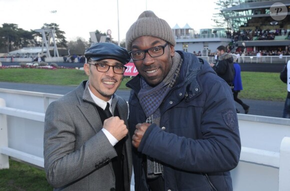 Lucien Jean-Baptiste et Brahim Asloum lors du 92eme Grand Prix d'Amérique à l'hippodrome de Vincennes, le 27 janvier 2013.