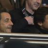 Nicolas Sarkozy et le directeur sportif Leonardo attentifs pendant la rencontre PSG - Montpellier au Parc des Princes, Paris, le 29 mars 2013.
