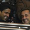 Nicolas Sarkozy hilare avec le président parisien lors de la rencontre PSG - Montpellier au Parc des Princes, Paris, le 29 mars 2013.