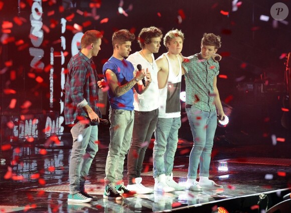 Liam Payne et son groupe One Direction en concert à Londres, le 23 février 2013.