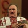 Gerard Depardieu s'est rendu le 6 janvier 2013 a Saransk, capitale de la Mordovie, republique autonome russe. Des femmes, en costume traditionnels, ont chante a son arrivee sur le tarmac de l'aeroport de Saransk. Ici, l'acteur francais exhibe son passeport russe.06/01/2013 - Saransk