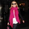 Reese Witherspoon, souriante, et son mari Jim Toth arrivent à l'aéroport de New York, le 13 mai 2013.