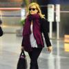 Reese Witherspoon et son mari Jim Toth arrivent à l'aéroport de New York, le 13 mai 2013.
