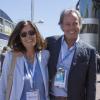 Michel Leeb et sa femme Béatrice dans les travées du paddock du Grand Prix de Monaco le 26 mai 2013