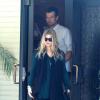 Fergie enceinte et son mari Josh Duhamel sortent de l'église à Brentwood, dans le quartier de Los Angeles, le 9 juin 2013.