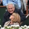 Dominique Strauss-Kahn et sa compagne Myriam L'Aouffir aux Internationaux de France de tennis de Roland-Garros le 9 juin 2013.