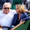 Dominique Strauss-Kahn et sa compagne Myriam L'Aouffir aux Internationaux de France de tennis de Roland-Garros le 8 juin 2013.