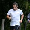 Nicolas Sarkozy fait un jogging avec ses gardes du corps au Bois de Boulogne. Paris, le 5 juillet 2013.