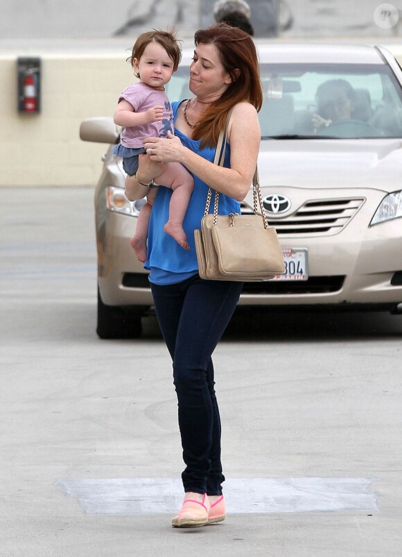 Exclusif - Alyson Hannigan et son mari Alexis Denisof en pleine séance de shopping avec leurs filles Satyana et Keeva à Los Angeles, le 26 Juillet 2013.