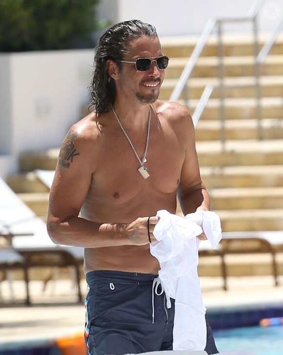 Exclusif - Le chanteur du groupe Soundgarden Chris Cornell et sa femme Vicky en vacances à Miami le 31 juillet 2013.