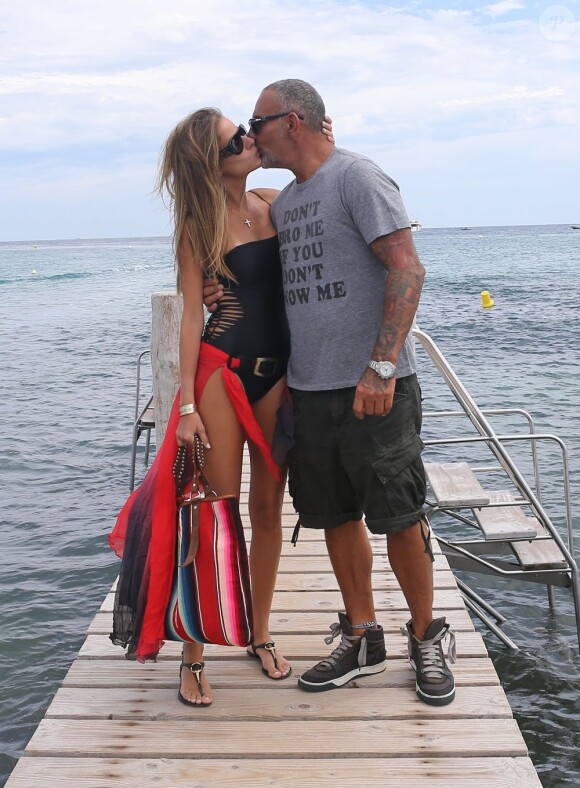 Christian Audigier et sa fiancée Nathalie Sorensen en vacances au club 55 à Ramatuelle, près de Saint-Tropez, le 8 août 2013.