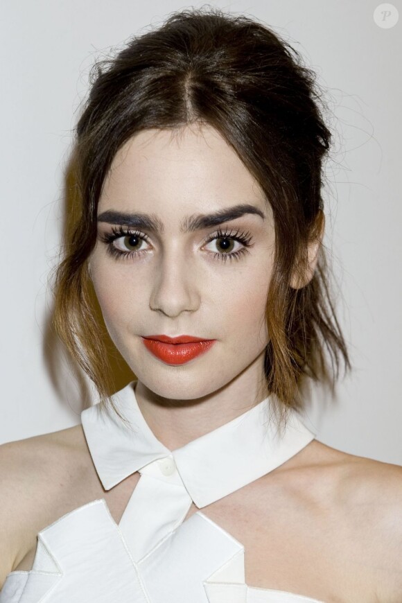 Lily Collins sexy lors de la soirée Flaunt Magazine au G-Star Raw store à Los Angeles, le 13 août 2013.