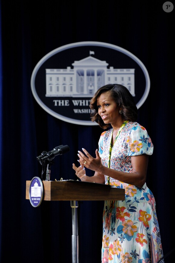La First Lady Michelle Obama a prononcé un discours avant la projection, face à des lycées, du documentaire "L'éminence grise : le combat de Whitney Young pour les droits civils" dans l'Auditorium de la Cour du Sud de l'Eisenhower Executive Office Building à côté de la Maison Blanche. Le 27 août 2013.