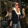 La chanteuse LeAnn Rimes et son mari Eddie Cibrian arrivent à l'aéroport LAX de Los Angeles pour prendre un avion. Le 27 août 2013.