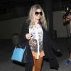 Fergie, enceinte, arrive à l'aéroport de Los Angeles, le 26 mai 2013.