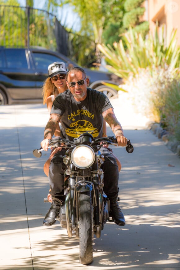 Christian Audigier et la jolie Nathalie Sorensen profitent de Los Angeles, le 26 août 2013 - Exclusif