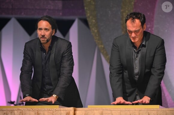 Nicolas Cage et Quentin Tarantino lors du dîner de bienvenue des Huading Awards à Macao, le 6 octobre 2013.