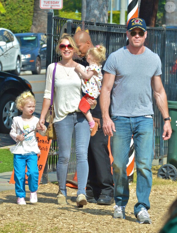Please hide the child's face prior to the publication Eric Dane and Rebecca Gayheart have some family fun at Mr. Bones Pumpkin Patch with their daughters Georgia and Billie in West Hollywood, Los Angeles, CA, USA on October 20, 2013. The two girls rode on the rides and searched for their favorite pumpkin. Photo by GSI/ABACAPRESS.COM21/10/2013 - Los Angeles