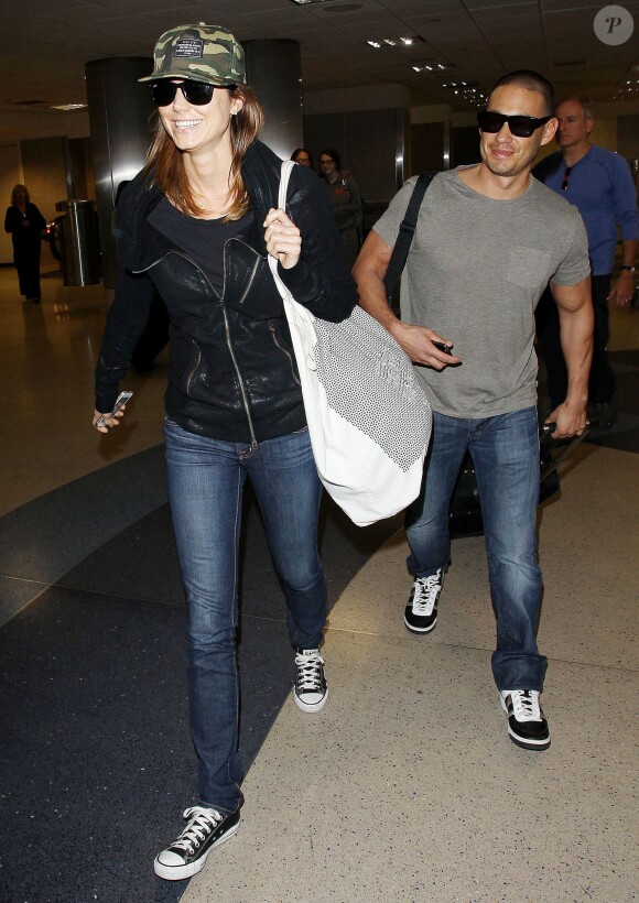 Stacy Keibler et son compagnon Jared Pobre arrivant à l'aéroport de Los Angeles le 7 décembre 2013