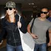 Stacy Keibler et son compagnon Jared Pobre arrivant à l'aéroport de Los Angeles le 7 décembre 2013