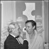 Maurice Chevalier salue Yves Montand dans sa loge de l'Olympia, en 1968.