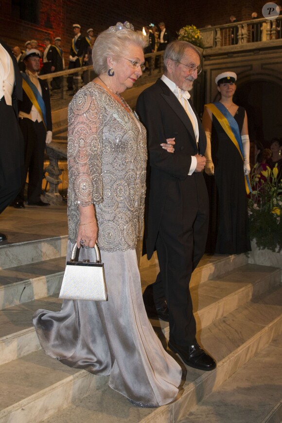 La princesse Christina de Suède et Martin Karplus (laureat du prix Nobel de chimie) arrivent au banquet organisé en l'honneur des lauréats des Nobel 2013, à l'Hôtel de Ville de Stockholm le 10 décembre 2013