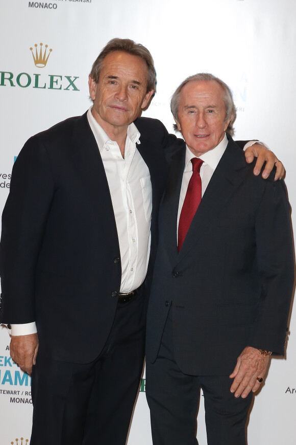 Jacky Ickx et Jackie Stewart lors de l'avant-première du documentaire "Week-End of a Champion" de Roman Polanski au Grimaldi Forum à Monaco, le 16 decembre 2013.