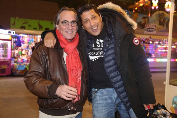 Philippe Lavil et Smain à la soirée d'inauguration de "Jours de Fêtes" au Grand Palais à Paris, organisée par Marcel Campion, le 19 décembre 2013.