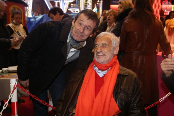 Jean-Luc Reichmann et Jean-Paul Belmondo à la soirée d'inauguration de "Jours de Fêtes" au Grand Palais à Paris, organisée par Marcel Campion, le 19 décembre 2013.