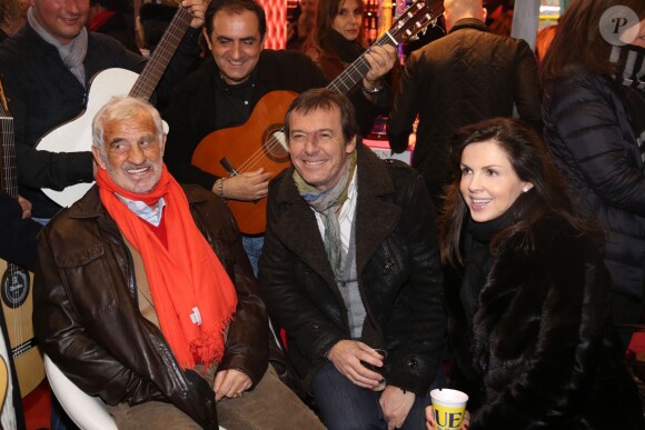 Jean-Luc Reichmann, Jean-Paul Belmondo et Caroline Barclay à la soirée d'inauguration de "Jours de Fêtes" au Grand Palais à Paris, organisée par Marcel Campion, le 19 décembre 2013.
