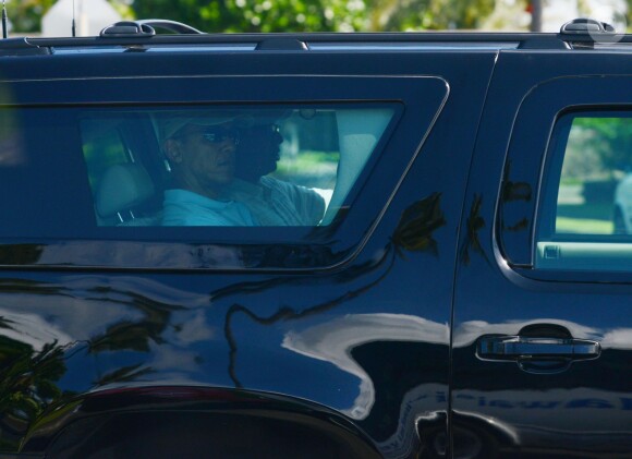 President Barack Obama rides in his armored SUV on his way out of Kailuana Street in Kailua, Hawaii on his way to golf at the Marine Corps Base Hawaii located in Kaneohe, Hawaii, USA on December 24, 2013. The entire motorcade then separated from our pool bus and left the pool bus to travel alone to the Mokapu Mall away from the golf course. Photo Pool by Cory Lum/ABACAPRESS.COM26/12/2013 - Honolulu