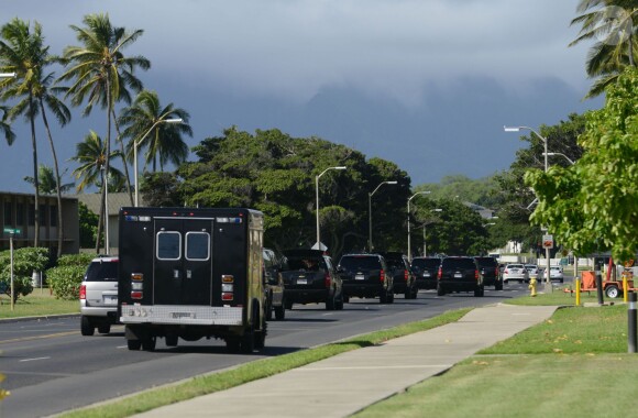 President Barack Obama rides in his armored SUV on his way to his golf outing at the Marine Corps Base Hawaii located in Kaneohe, Hawaii, USA on December 24, 2013. The entire motorcade then separated from our pool bus and left the pool bus to travel alone to the Mokapu Mall away from the golf course. Photo Pool by Cory Lum/ABACAPRESS.COM26/12/2013 - Honolulu