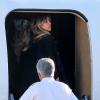 Kim Kardashian part en jet privé avec sa famille de l'aéroport de Los Angeles, le 27 décembre 2013.