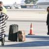 Kim Kardashian et sa grande famille montent à bord d'un jet privé à l'aéroport de Van Nuys. Los Angeles, le 27 décembre 2013.