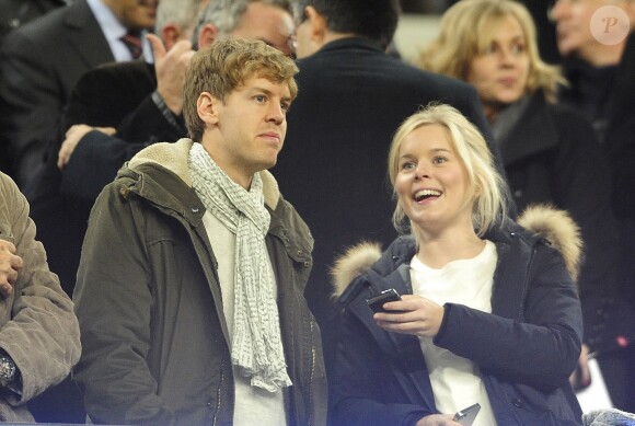 Sebastian Vettel et sa compagne Hanna Prater lors d'un match entre le FC Barcelone et Valence au Camp Nou de Barcelone, le 19 février 2012