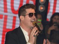 Robin Thicke, bien proche d'une brune sexy en boîte à Paris... Et sa femme alors ?