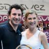 Michael Youn, Michele Laroque à l'occasion d'un match caritatif en marge du 22e Open de tennis GDF SUEZ au Stade Pierre de Coubertin à Paris le 28 Janvier 2014.
