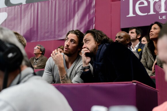 Henri Leconte et son fils Maxime à l'occasion d'un match caritatif en marge du 22e Open de tennis GDF SUEZ au Stade Pierre de Coubertin à Paris le 28 Janvier 2014.