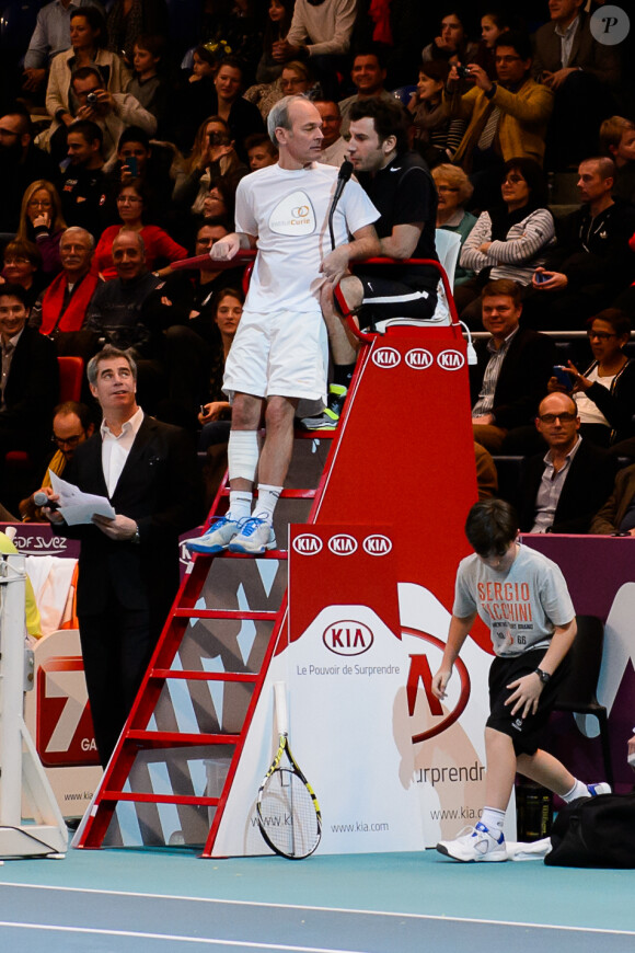 Laurent Baffie, Michaël Youn à l'occasion d'un match caritatif en marge du 22e Open de tennis GDF SUEZ au Stade Pierre de Coubertin à Paris le 28 Janvier 2014.