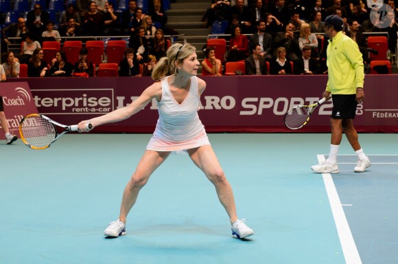 Michèle Laroque, Yannick Noah à l'occasion d'un match caritatif en marge du 22e Open de tennis GDF SUEZ au Stade Pierre de Coubertin à Paris le 28 Janvier 2014.