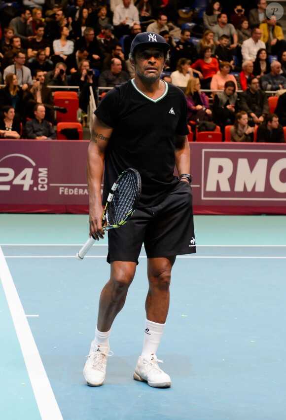Yannick Noah à l'occasion d'un match caritatif en marge du 22e Open de tennis GDF SUEZ au Stade Pierre de Coubertin à Paris le 28 Janvier 2014.