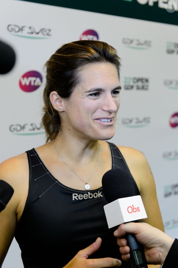 Amelie Mauresmo à l'occasion d'un match caritatif en marge du 22e Open de tennis GDF SUEZ au Stade Pierre de Coubertin à Paris le 28 Janvier 2014.