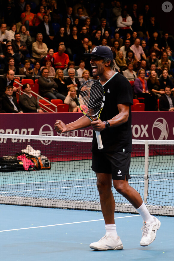 Yannick Noah à l'occasion d'un match caritatif en marge du 22e Open de tennis GDF SUEZ au Stade Pierre de Coubertin à Paris le 28 Janvier 2014.