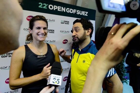 Amelie Mauresmo, Cyril Hanouna à l'occasion d'un match caritatif en marge du 22e Open de tennis GDF SUEZ au Stade Pierre de Coubertin à Paris le 28 Janvier 2014.