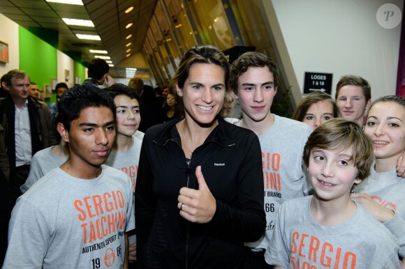 Amelie Mauresmo à l'occasion d'un match caritatif en marge du 22e Open de tennis GDF SUEZ au Stade Pierre de Coubertin à Paris le 28 Janvier 2014.