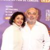 Gérard Jugnot et sa compagne Saïda Jawad lors du 17eme Festival international du film de comédie de l'Alpe d'Huez, le 17 janvier 2014.