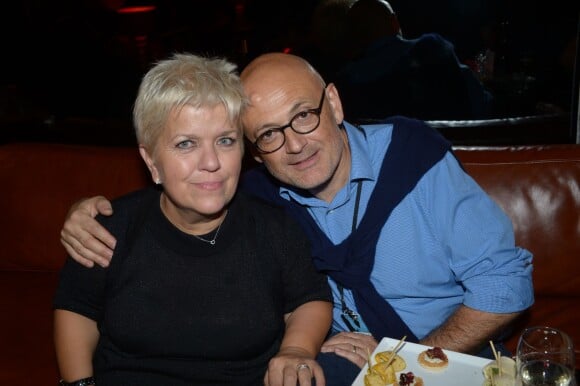 Mimie Mathy et son mari lors de l'After Show des "Enfoirés" chez Castel à Paris, le 28 janvier 2013.
