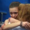 Adelina Sotnikova, en pleurs et dans les bras de son coach, est devenue la première championne olympique de patinage artistique lors des Jeux olympiques de Sotchi le 20 février 2014 à l'Iceberg Skating Palace de Sotchi